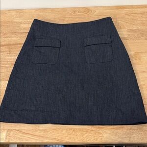 Classic dark wash skirt with two front pockets
